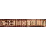 A Yumut tent band:, the cream field with hooked and serrated geometric designs, 647cm x 22cm.
