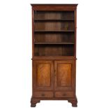 A mahogany upright bookcase:, the upper part with a moulded dentil cornice,