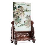 A Chinese famille rose porcelain table screen: enamelled with figures approaching a pagoda and