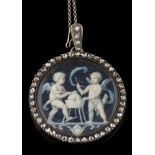 A 19th century circular portrait miniature pendant depicting cupids,