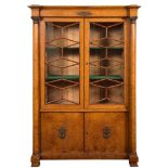 A French Charles X gilt metal mounted burr maple bookcase,