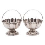 A pair of Edward VII silver swing handled bon bon baskets, maker A & J Zimmerman Ltd, Birmingham,