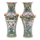 A pair of Chinese porcelain vases: of baluster form with gold mask handles decorated in the rose