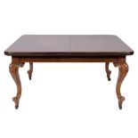 A Victorian mahogany extending dining table on cabriole legs and a set of twelve late 19th century