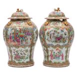 A pair of 19th century Canton famille rose/verte baluster jars and covers: each with gilt lion dog