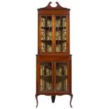 An Edwardian mahogany and inlaid standing corner display cabinet:, in two parts,