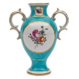 A Chelsea-Derby turquoise ground baluster vase: with rococo scroll handles,