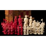 A late 19th century Cantonese Mandarin pattern ivory chess set: one side stained red,