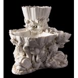 A Plymouth [William Cookworthy] white glazed shell and dolphin centrepiece: in the form of three