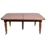 An early 19th Century mahogany extending dining table:, with a telescopic action,