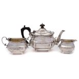 A late Victorian bachelor's silver matched three-piece tea service, maker Charles Stuart Harris,