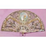 A 19th Century French fan: the gauze leaf with central cartouche painted with a gallant and lady,