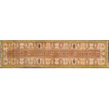 A Turkish runner:, the light brown rectangular panel with a row of serrated stellar medallions,