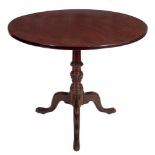 A Georgian mahogany circular tea table:,