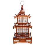 A Chinese wood bird cage: of pagoda outline,