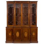 A 19th Century mahogany and inlaid breakfront library bookcase:,