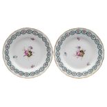 A pair of Derby plates: each finely painted in the manner of Edward Withers with a floral spray and