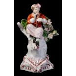 A Plymouth porcelain figure of a musician: playing a recorder and wearing a plumed hat,