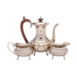 A George V silver three-piece bachelor's tea service, maker Hukin & Heath Ltd, Birmingham,