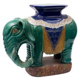 A pair of Chinese stoneware elephant garden seats: decorated in blue, green,