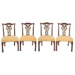 A set of six 19th Century carved mahogany dining chairs in the Chippendale taste:,