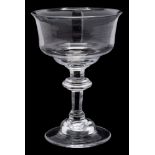 An English sweetmeat glass: the mildly flaring ogee shaped bowl set on a inverted baluster stem