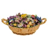 A Minton porcelain 'Trompe l'oeil' basket of flowers: the oval apricot ground basket with branch