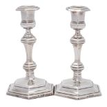 A matched pair of silver candlesticks, maker Thomas Bradbury & Sons Ltd, Sheffield, 1918 and London,