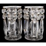 A pair of cut glass table lustres: with circular cut bases supporting a hollow stem with facet cut