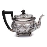 A Victorian silver teapot, maker Martin Hall & Co, Sheffield, 1897: of barge-shaped outline,