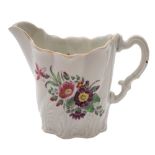 A First Period Worcester 'High Chelsea Ewer' cream jug: with leaf moulded wrythen body and painted