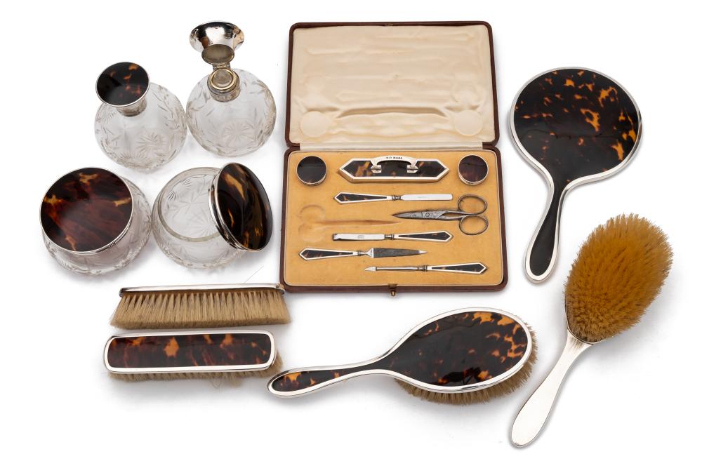 An Art Deco period tortoiseshell and silver mounted matched dressing table set,