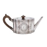 A Victorian silver teapot, maker Charles Stuart Harris, London, 1876: crested,