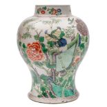 A Chinese famille verte baluster jar: brightly painted with birds, bamboo,