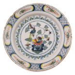 An English delft charger, probably Bristol: painted in red, blue,