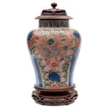 A Chinese wucai baluster jar: painted with horses,