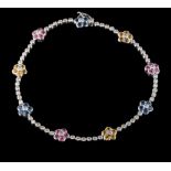 An 18ct white gold, sapphire and diamond bracelet: with floral clusters of pink,