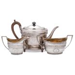 A George III three-piece tea service and a matching teapot stand, maker John Emes, London,