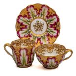 Four John Ridgway porcelain trios: each comprising two cups and a saucer, one decorated in red,