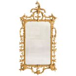 A Chippendale period carved giltwood mirror: the rectangular plate enclosed within a frame of