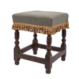 A late 17th Century oak square stool:, with stuff over seat,