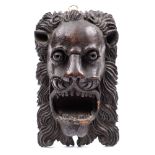 A late 16th Century carved oak lion mask: with flared nostrils, open mouth upper and lower teeth,