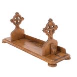 A 19th Century oak book trough in the Gothic taste: the rectangular base with two sliding ends