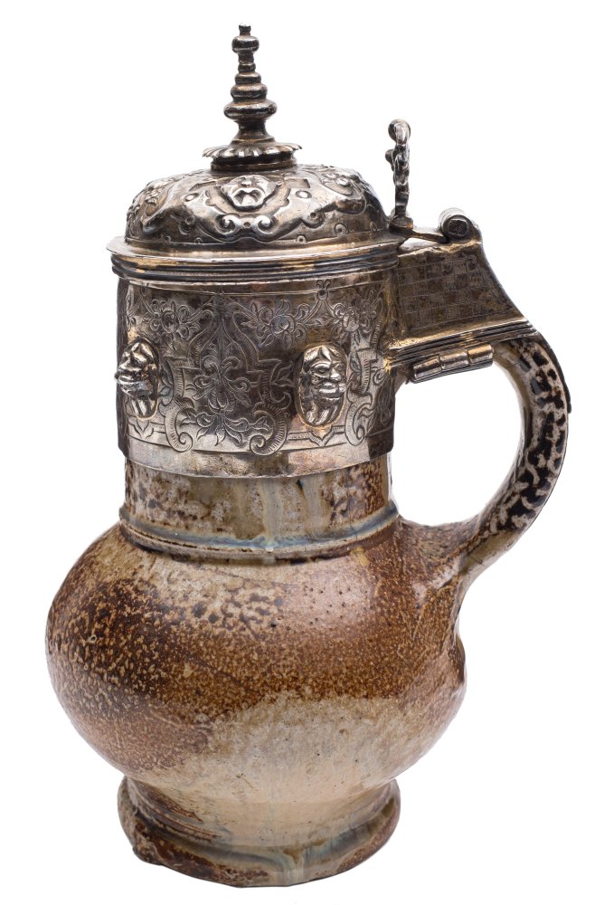 An Elizabethan armorial silver-gilt mounted 'Tigerware' jug: with cylindrical neck and strap handle,