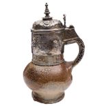 An Elizabethan armorial silver-gilt mounted 'Tigerware' jug: with cylindrical neck and strap handle,