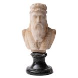 A carved white marble bust of Cellini: unsigned, on black marble socle, overall height 23cm.