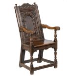 A James I carved oak open armchair:,