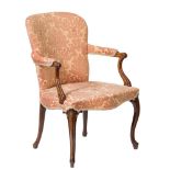 A George III mahogany open armchair in the French Heppplewhite taste: with an upholstered stuff