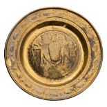 A late 17th/early 18th Century Dutch or Belgian (Malines) brass alms dish: with embossed decoration