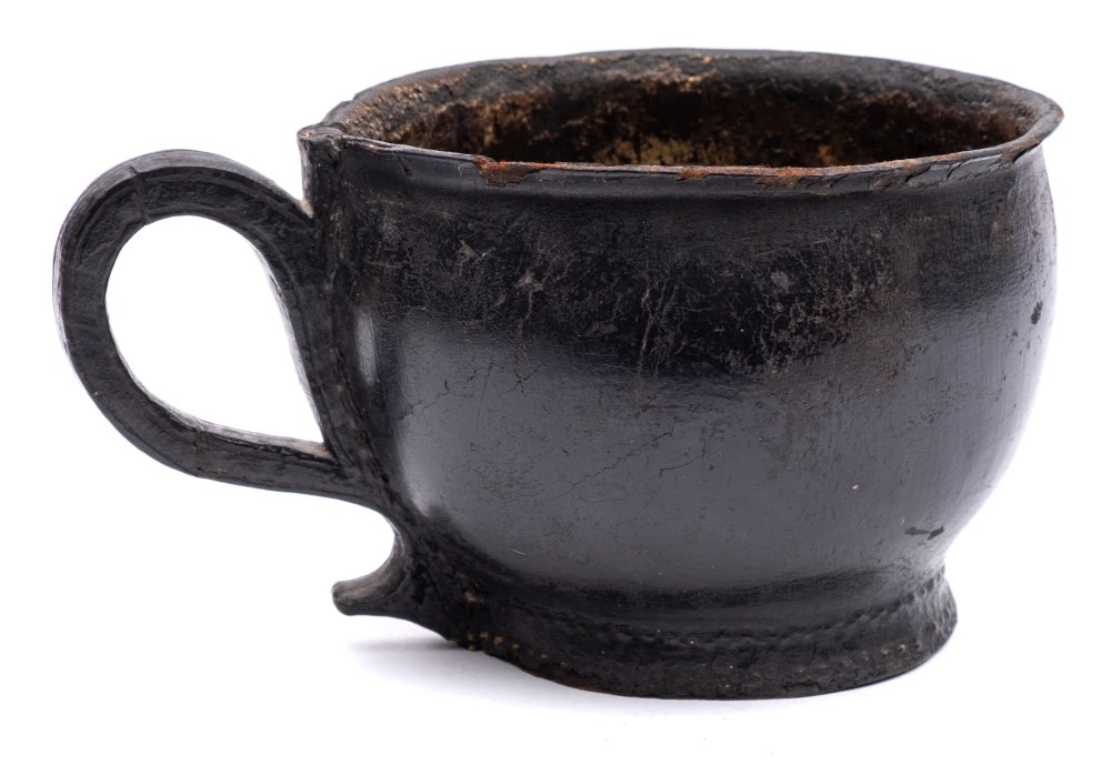 A very rare late 18th Century stitched leather chamber pot: of traditional design with loop